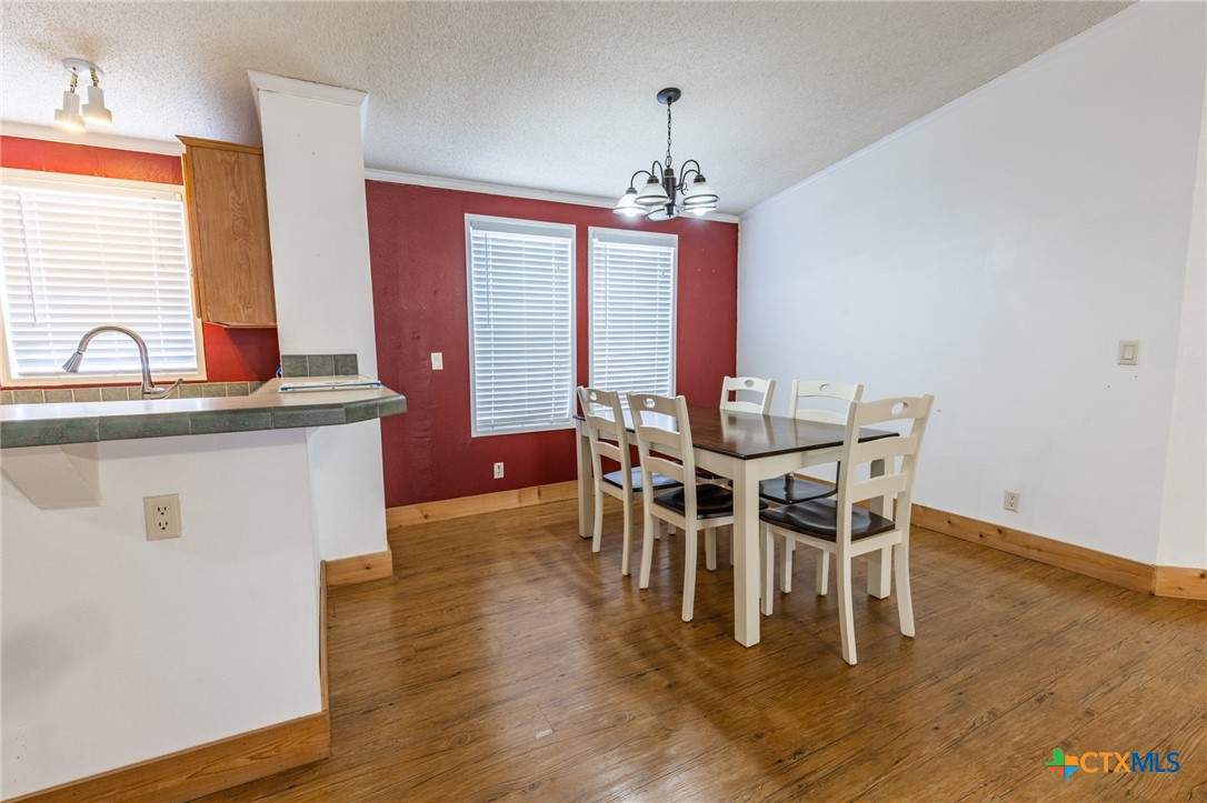 5526 Farm To Market 20 Seguin, TX 78155 - Photo 11 of 18 a view of a dining room with furniture window and wooden floor
