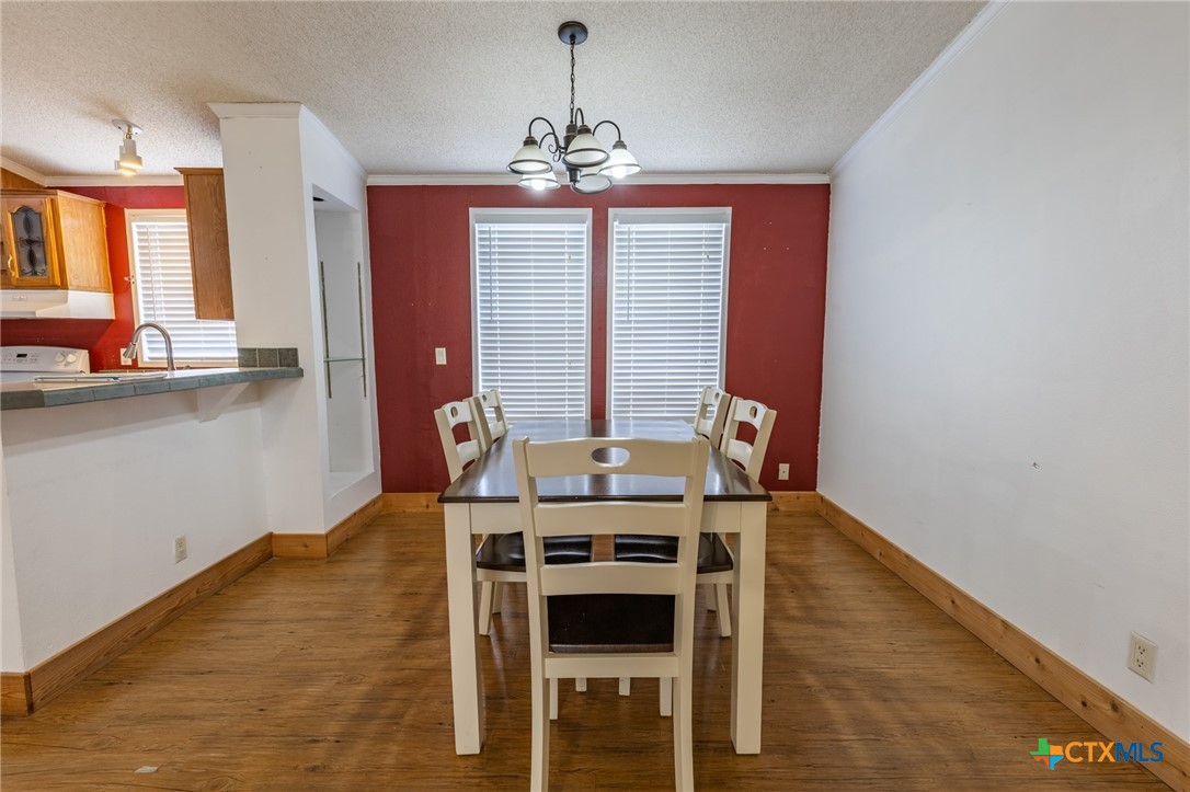 5526 Farm To Market 20 Seguin, TX 78155 - Photo 12 of 18 a view of a dining room with furniture and chandelier
