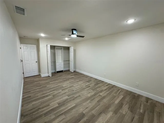 a view of an empty room with a chandelier
