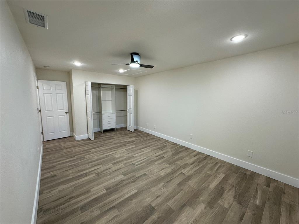 6013 Fortune Place, Unit 6013 Apollo Beach, FL 33572 - Photo 30 of 38 a view of an empty room with a chandelier