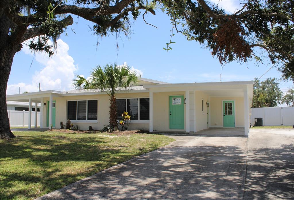 6013 Fortune Place, Unit 6013 Apollo Beach, FL 33572 - Photo 3 of 38 a front view of a house with garden