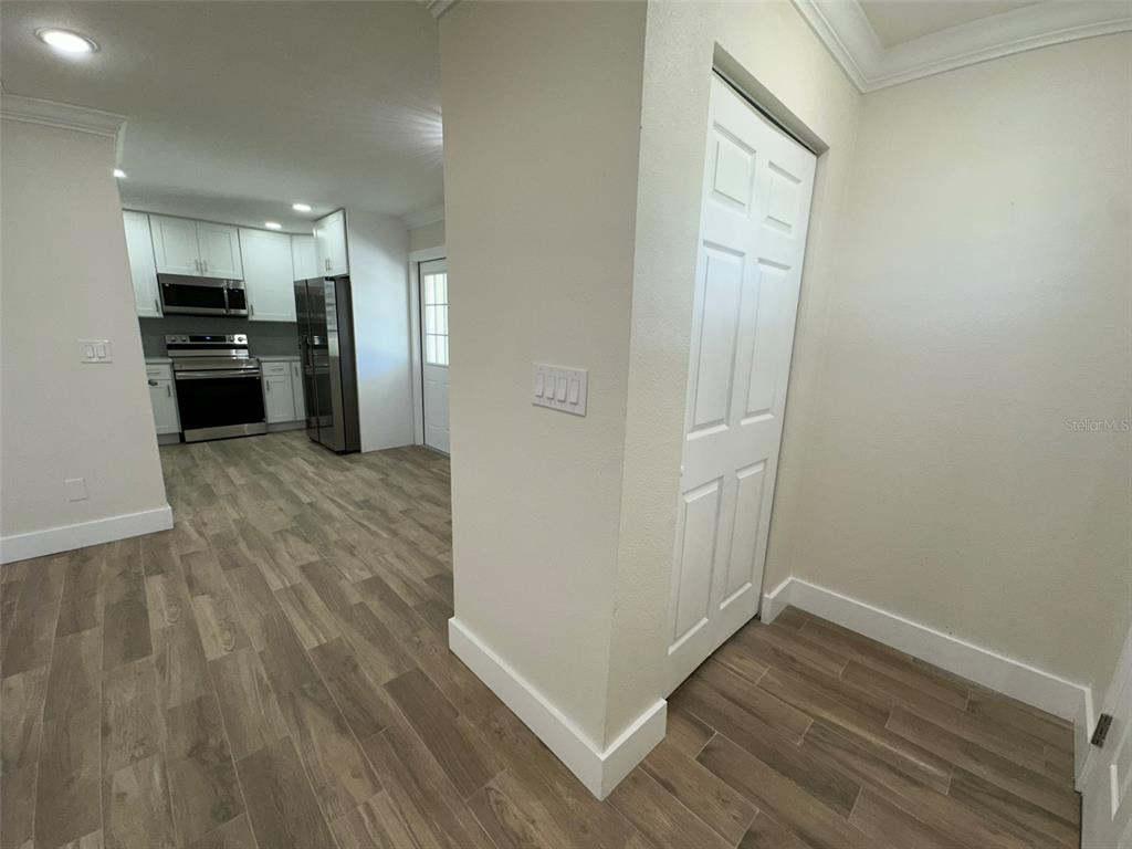 6013 Fortune Place, Unit 6013 Apollo Beach, FL 33572 - Photo 6 of 38 a view of a kitchen from the hallway