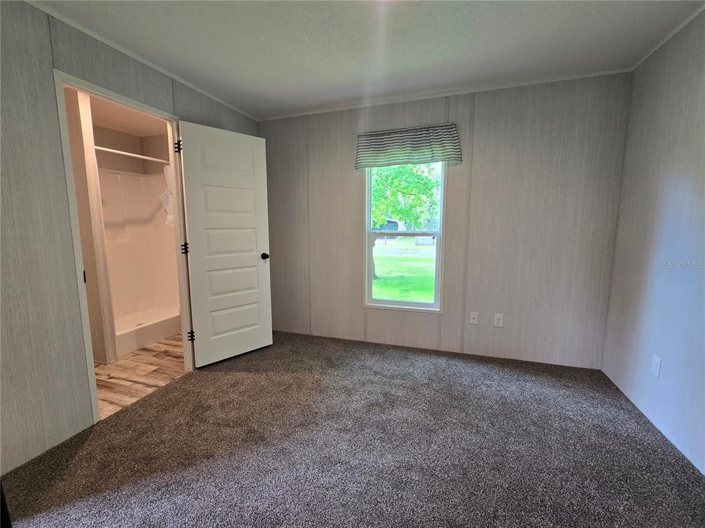 24048 Ermine Road Astor, FL 32102 - Photo 16 of 20 an empty room with windows