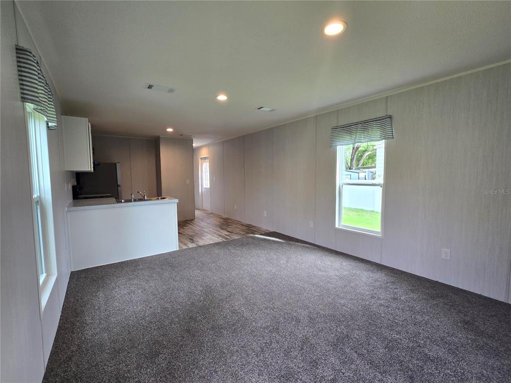 24048 Ermine Road Astor, FL 32102 - Photo 5 of 20 a view of an empty room with a window