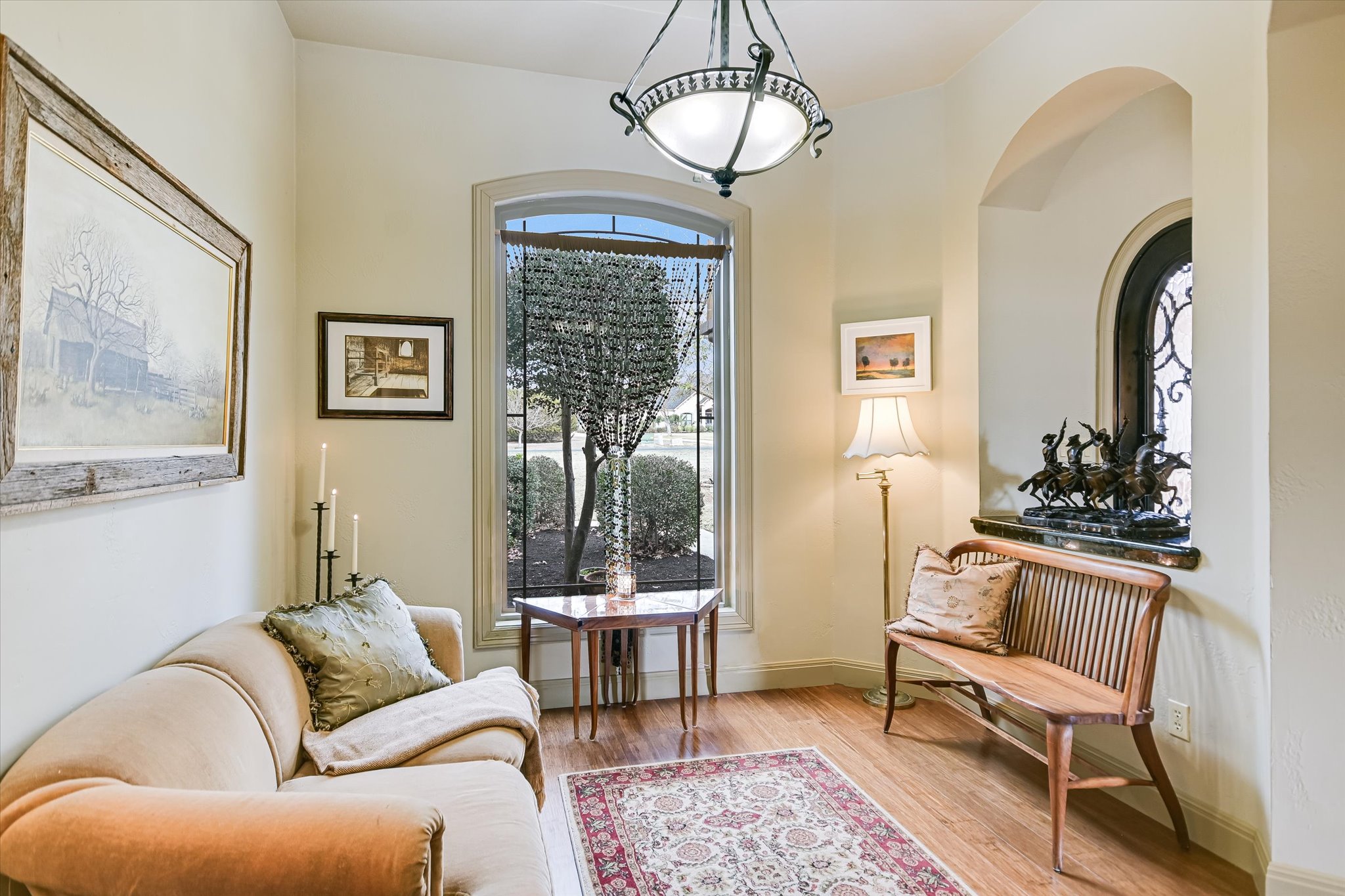 117 View Drive Georgetown, TX 78628 - Photo 11 of 40 Living area featuring light wood floors and baseboards with views through a fixed picture window to front yard.