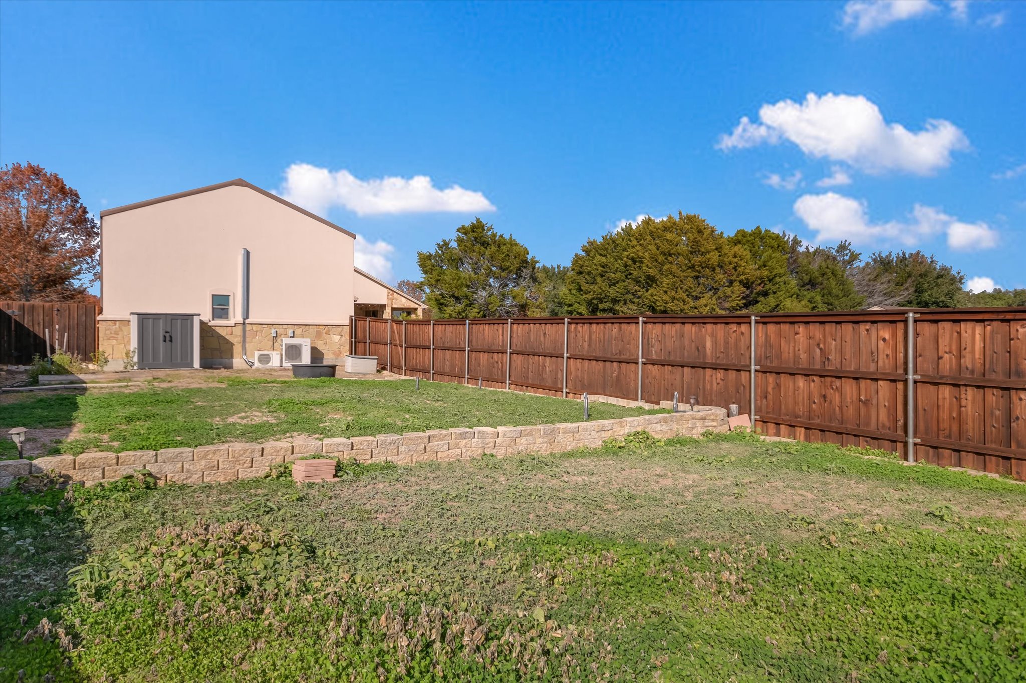 117 View Drive Georgetown, TX 78628 - Photo 32 of 40 View of fenced garden that includes a shed, drip irrigation and tiered planting area.