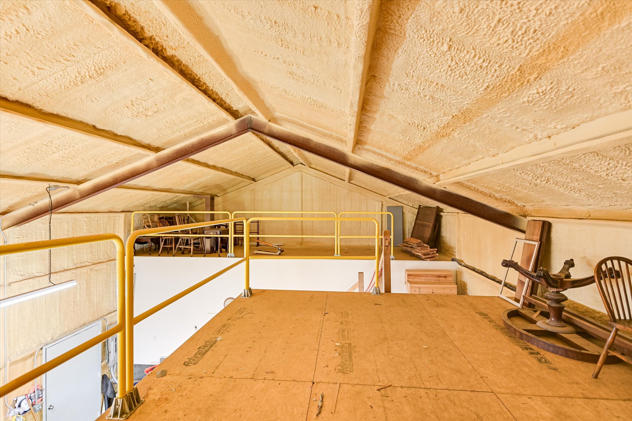 117 View Drive Georgetown, TX 78628 - Photo 32 of 40 View of the two loft storage areas. Note the steel framing and foam insulation.