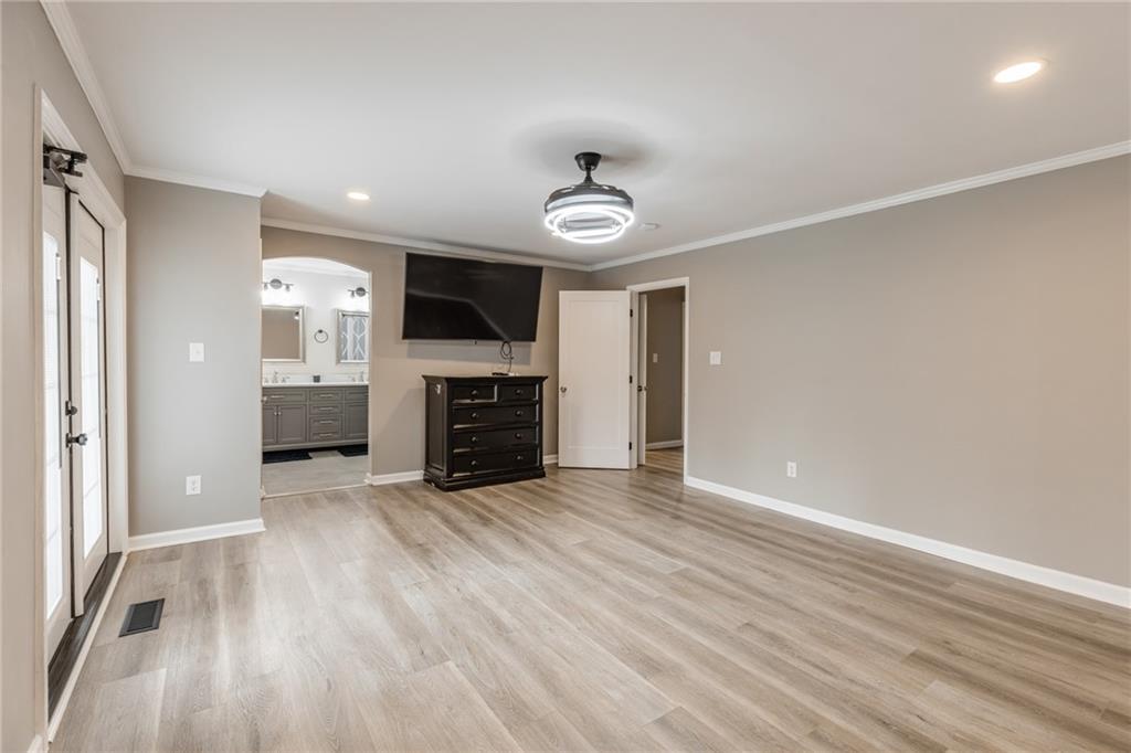 434 Rawley Road Americus, GA 31719 - Photo 33 of 50 wooden floor in an empty room with a fireplace