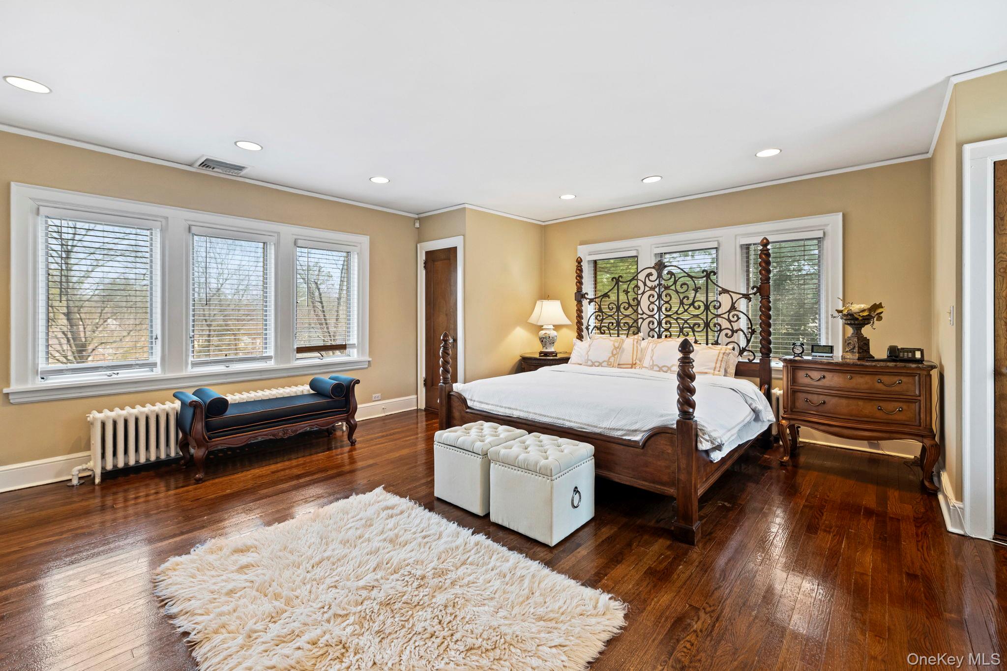 44 Fenimore Road New Rochelle, NY 10804 - Photo 18 of 46 a spacious bedroom with a bed and wooden floor