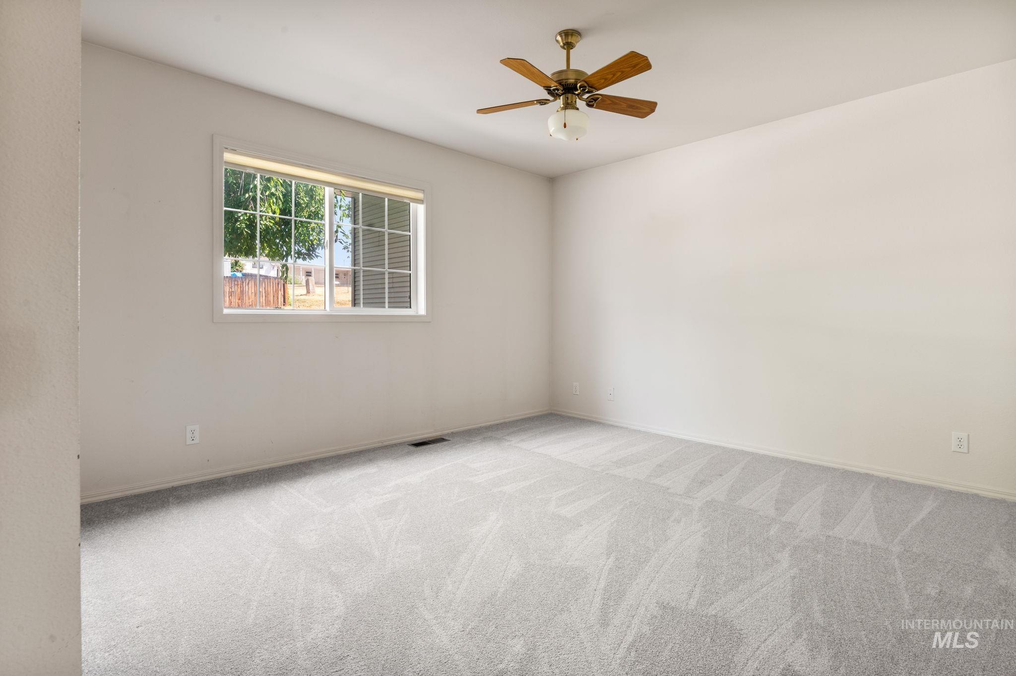 824 15th Avenue Lewiston, ID 83501 - Photo 16 of 37 Carpeted spare room with ceiling fan and baseboards
