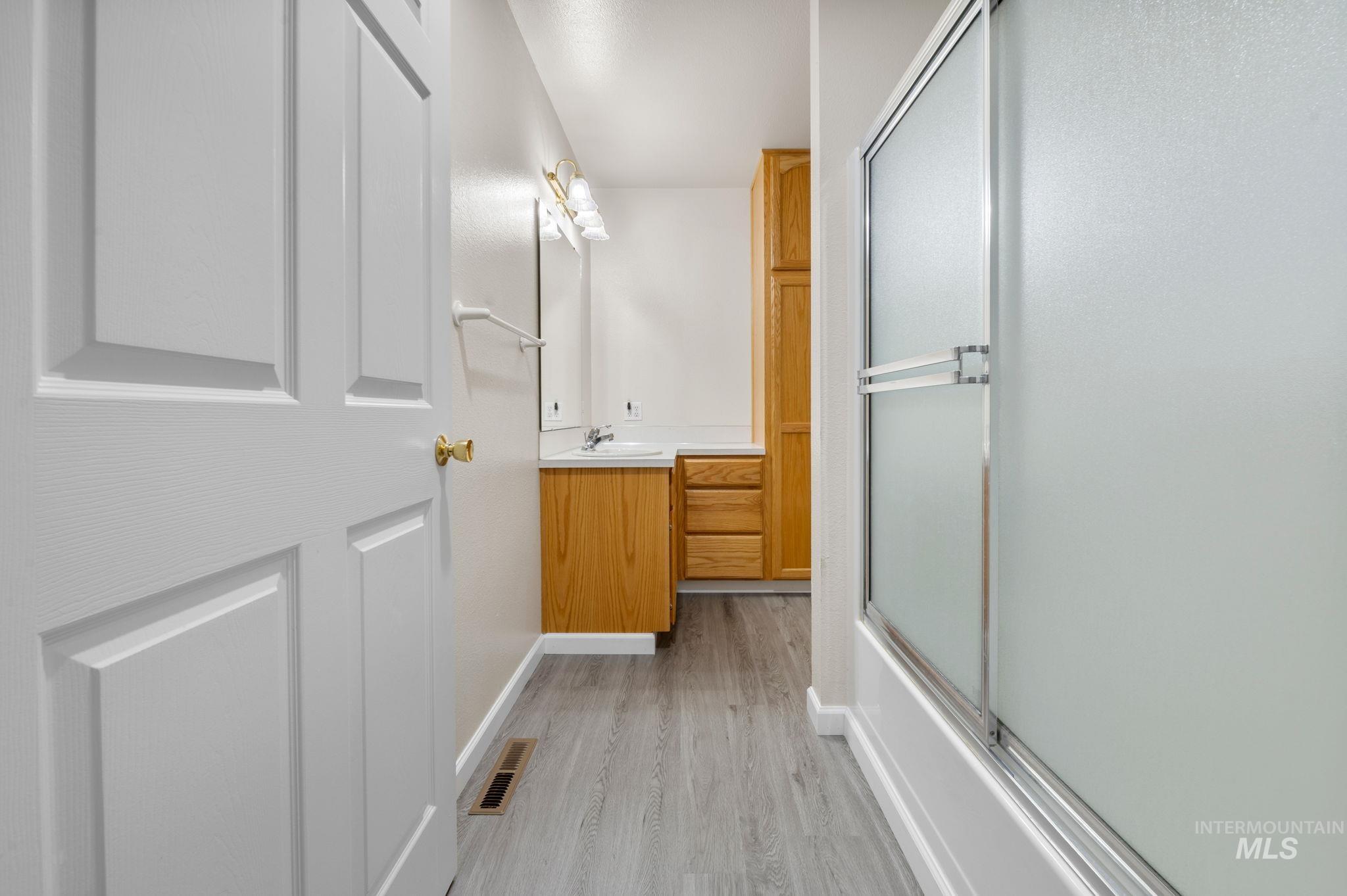 824 15th Avenue Lewiston, ID 83501 - Photo 17 of 37 Bathroom featuring vanity and wood finished floors