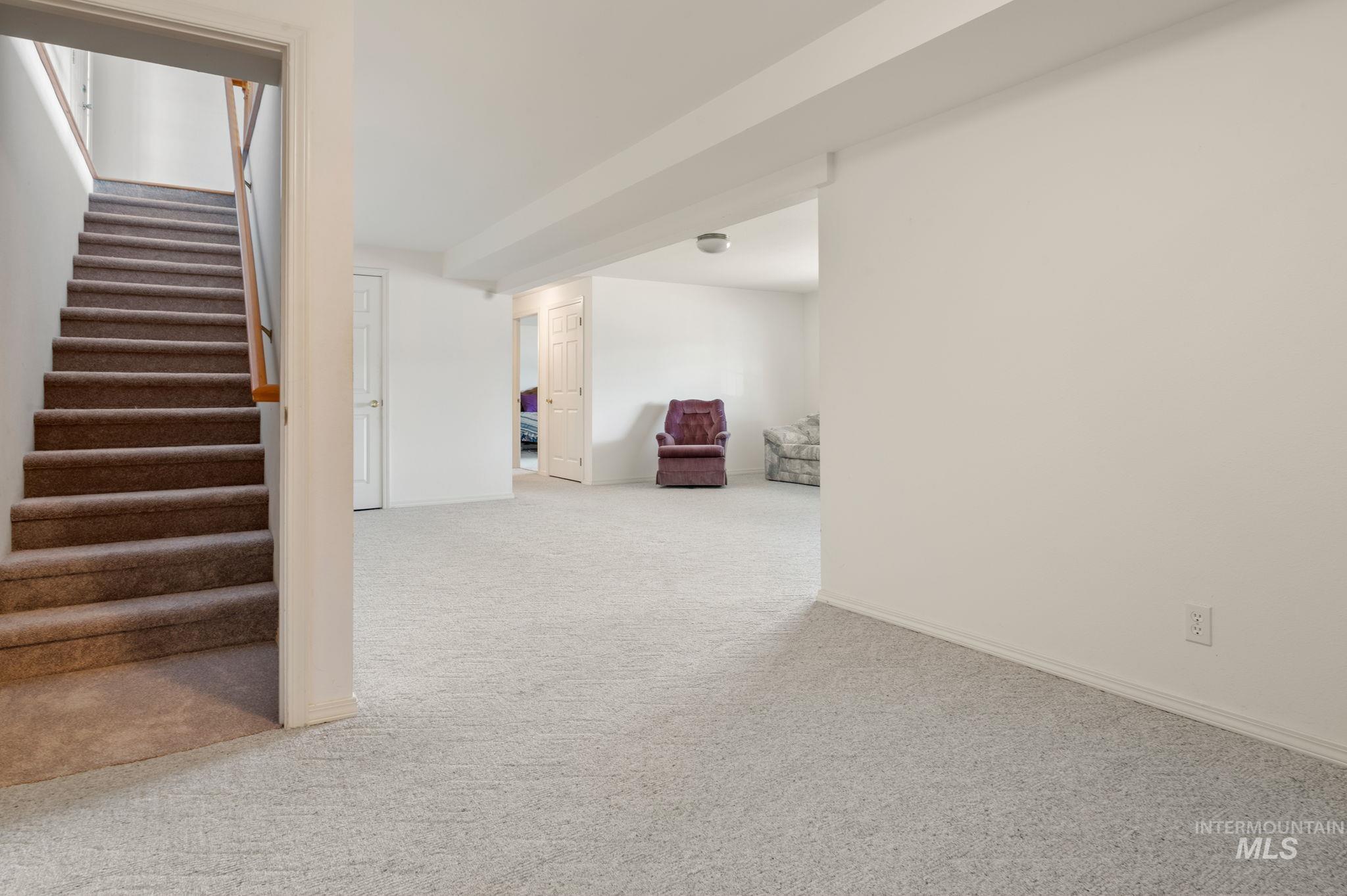 824 15th Avenue Lewiston, ID 83501 - Photo 22 of 37 Finished below grade area featuring carpet floors and stairway