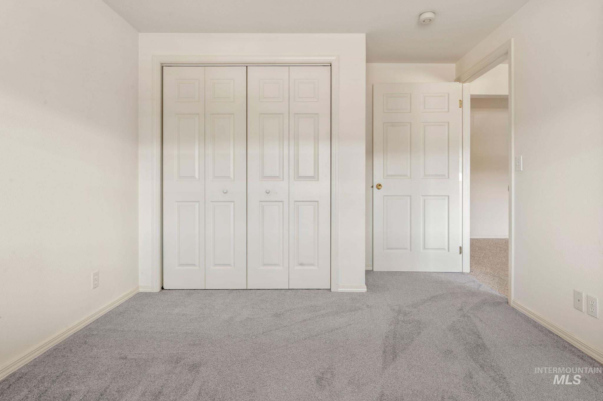 824 15th Avenue Lewiston, ID 83501 - Photo 24 of 37 Unfurnished bedroom featuring carpet and a closet