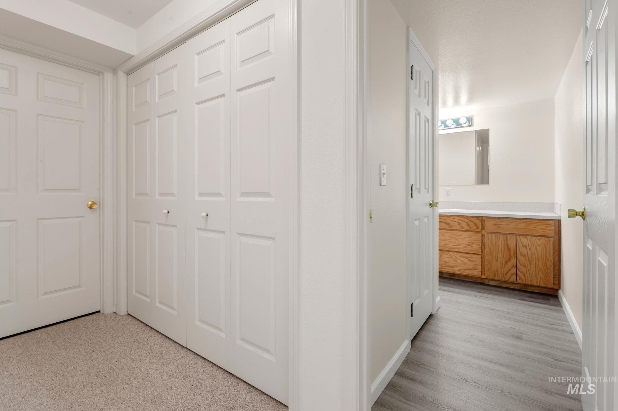 824 15th Avenue Lewiston, ID 83501 - Photo 32 of 37 Corridor with baseboards and light wood-type flooring