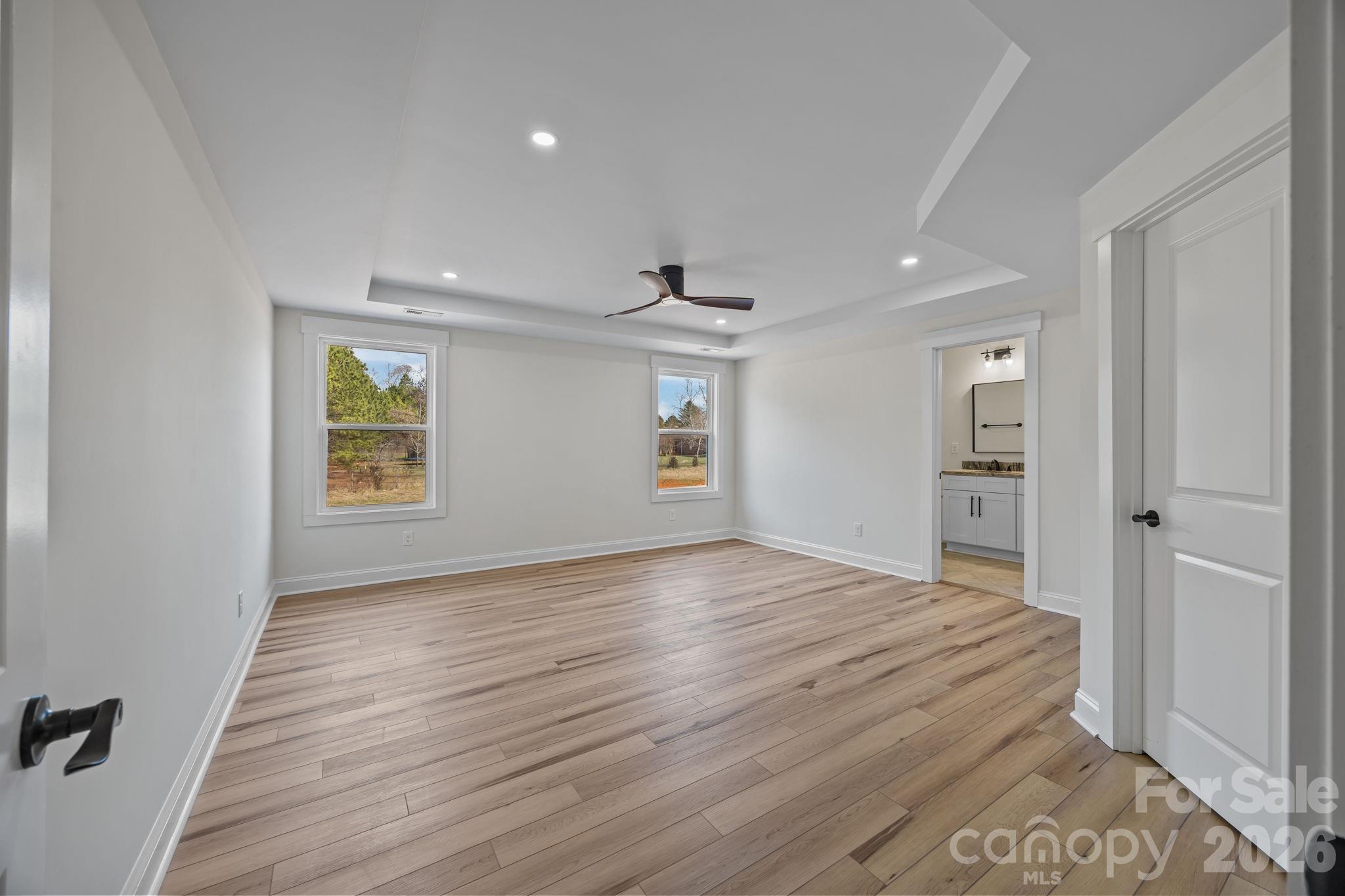 1050 Gibson Road Salisbury, NC 28147 - Photo 28 of 47 wooden floor in an empty room with a window