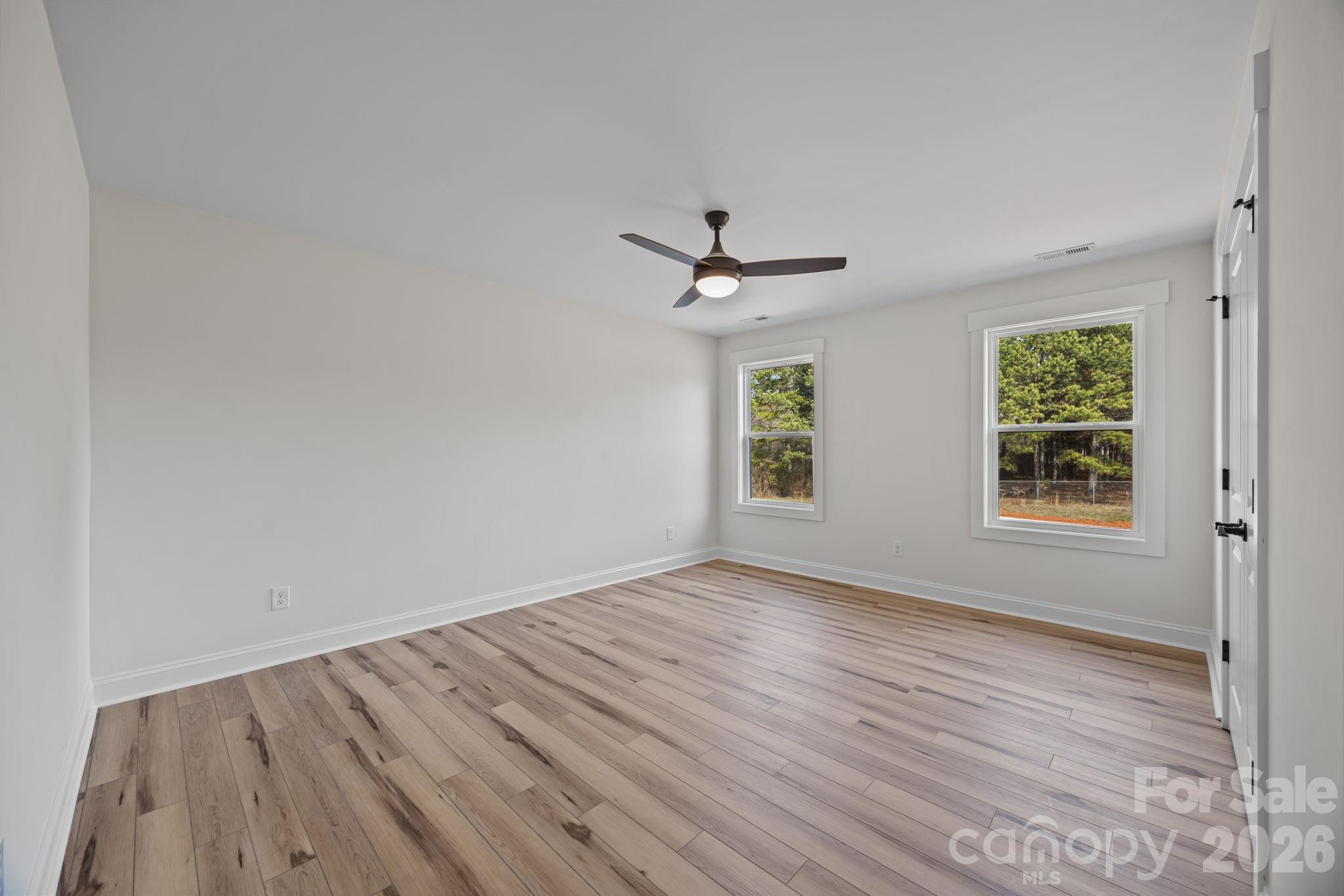1050 Gibson Road Salisbury, NC 28147 - Photo 35 of 47 wooden floor in an empty room with a window