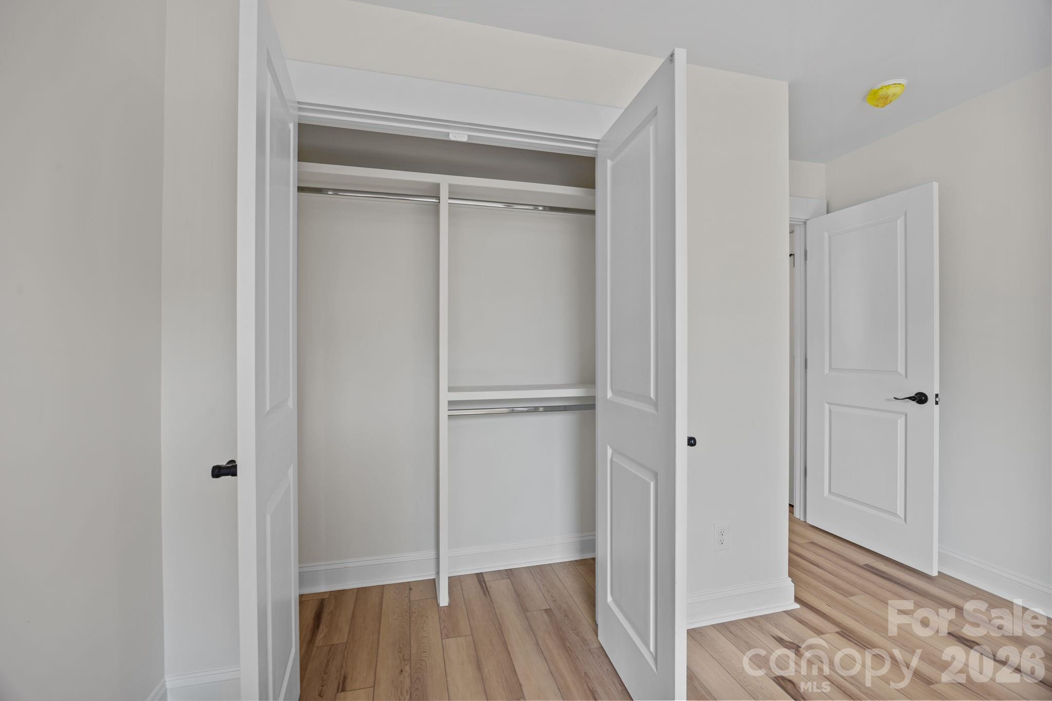 1050 Gibson Road Salisbury, NC 28147 - Photo 39 of 47 a view of walk in closet with wooden floor