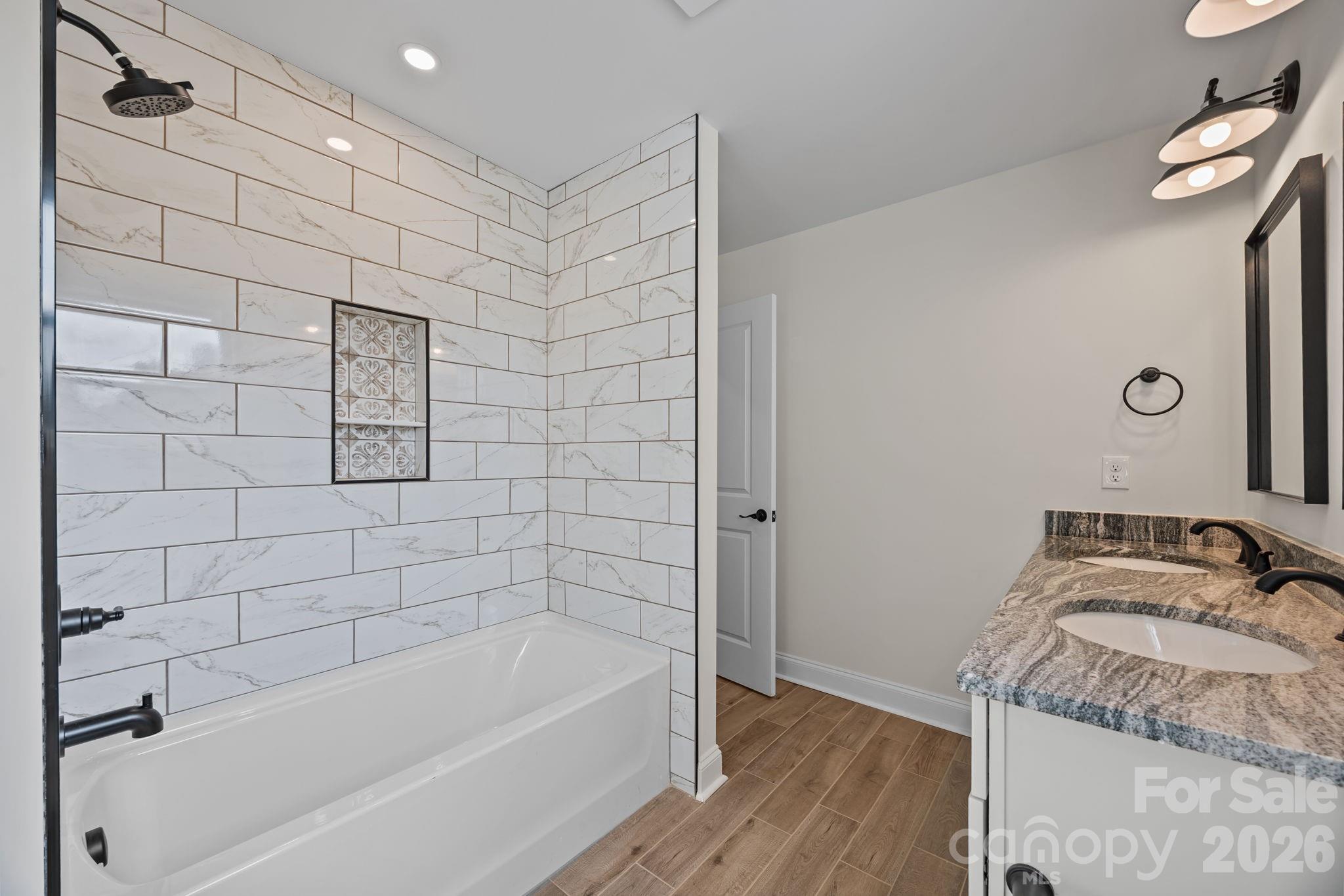 1050 Gibson Road Salisbury, NC 28147 - Photo 42 of 47 a bathroom with a granite countertop bathtub sink vanity and shower