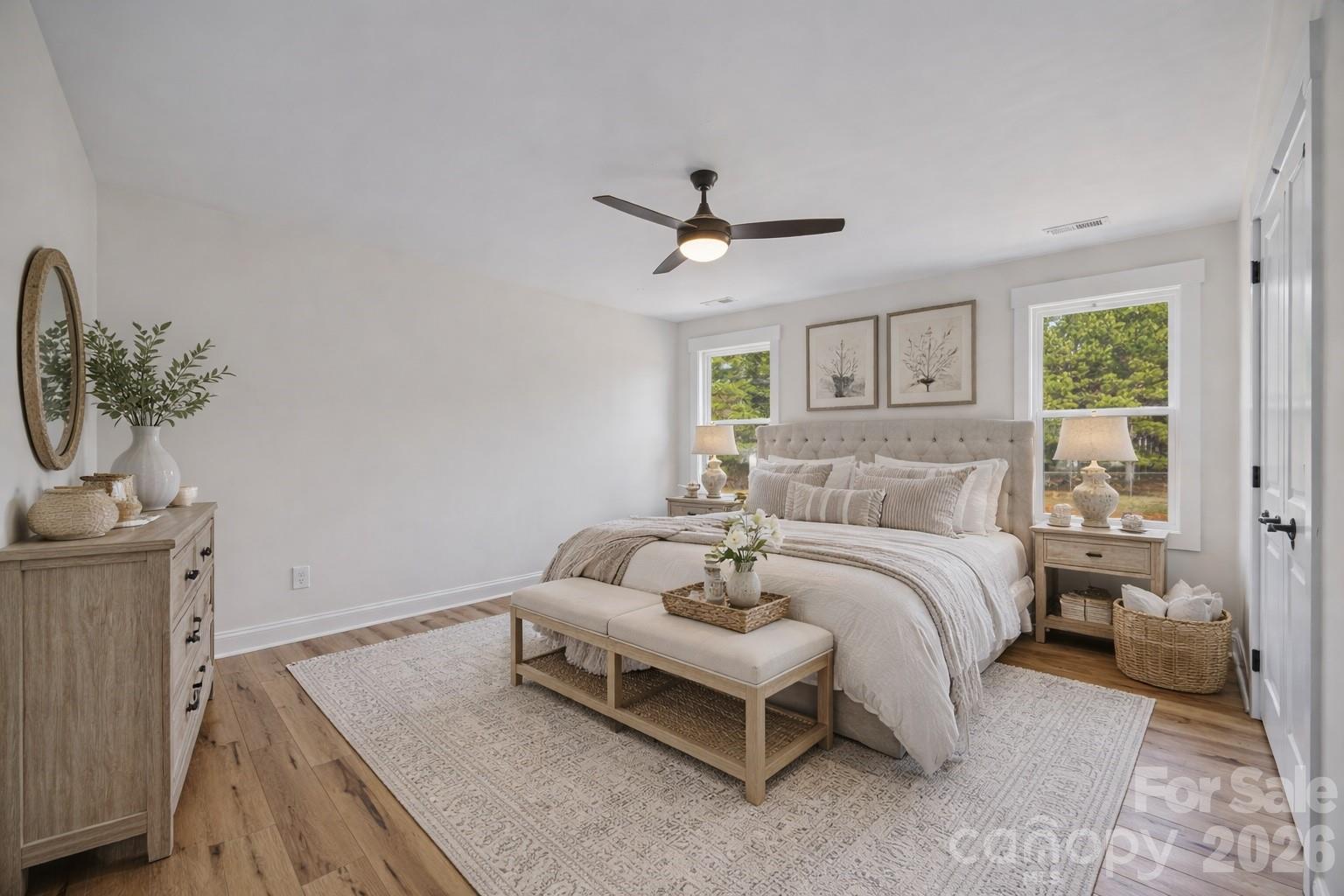 1050 Gibson Road Salisbury, NC 28147 - Photo 6 of 47 a spacious bedroom with a bed and a chandelier