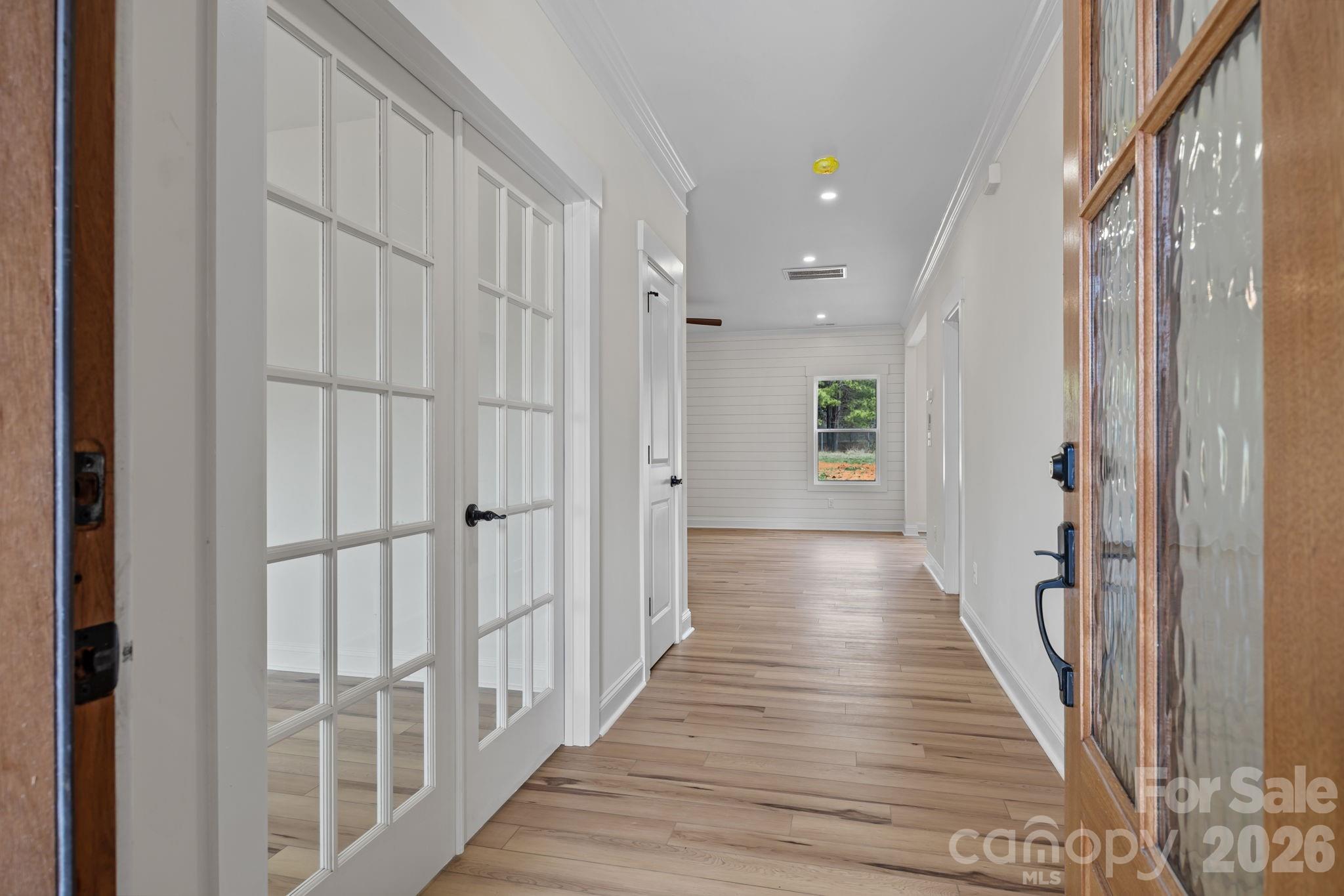 1050 Gibson Road Salisbury, NC 28147 - Photo 10 of 47 a view of a hallway with wooden floor and staircase
