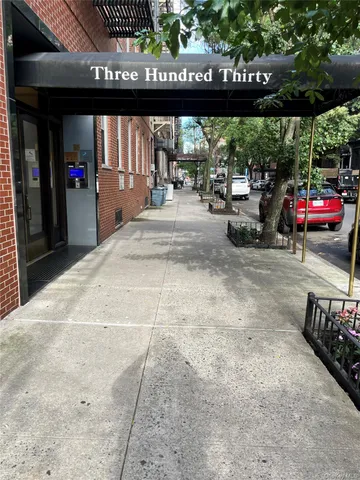 a view of a room with large windows
