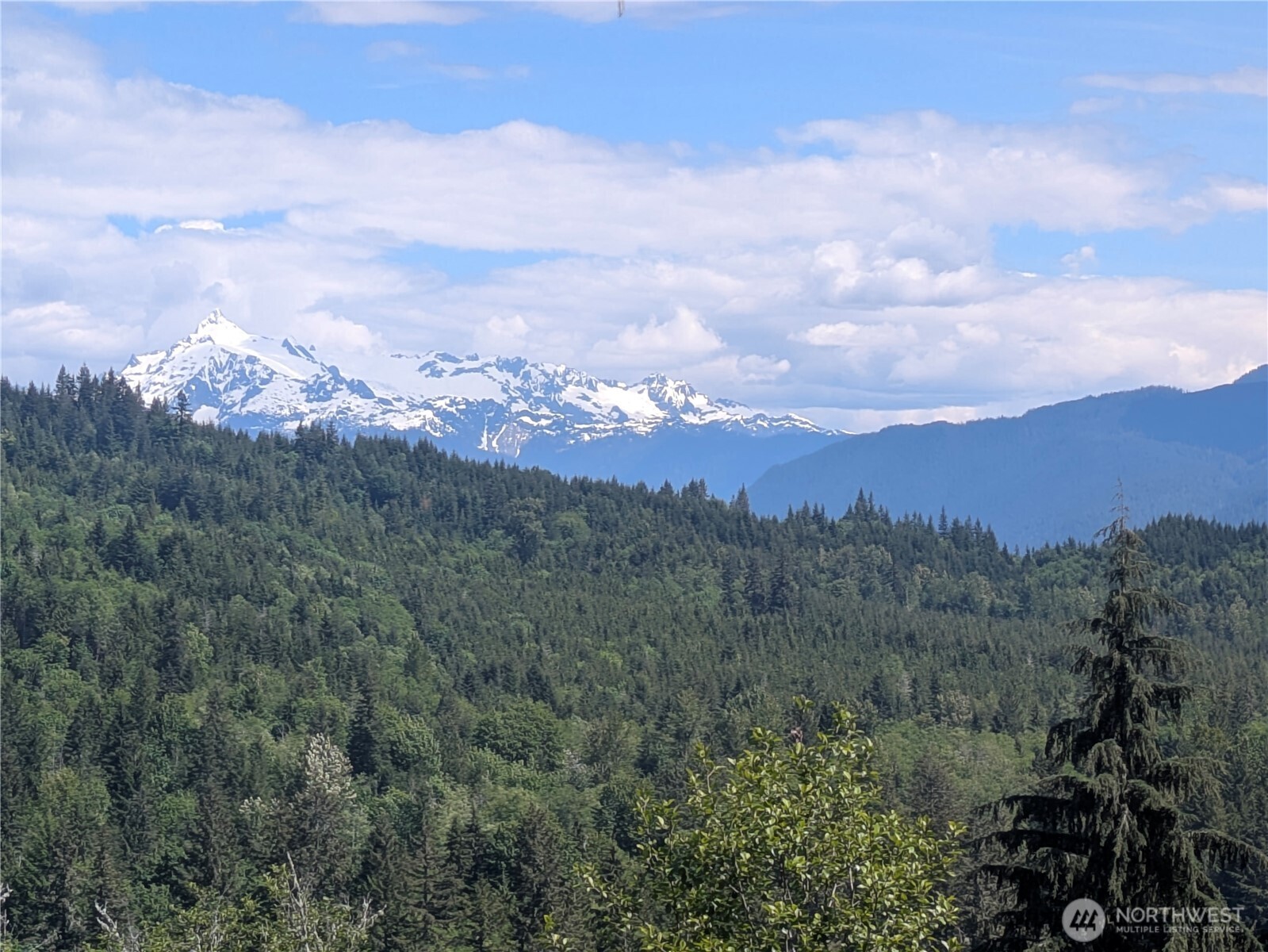 44957 Kachess Trail, Unit 2C97 Concrete, WA 98237 - Photo 12 of 16 a view of a mountain range with lush green forest