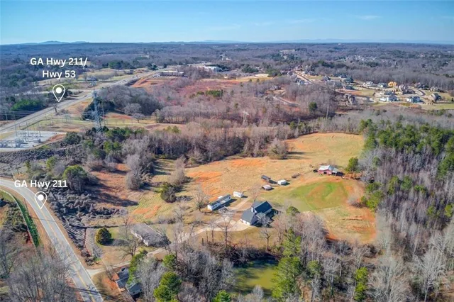 an aerial view of residential houses with outdoor space