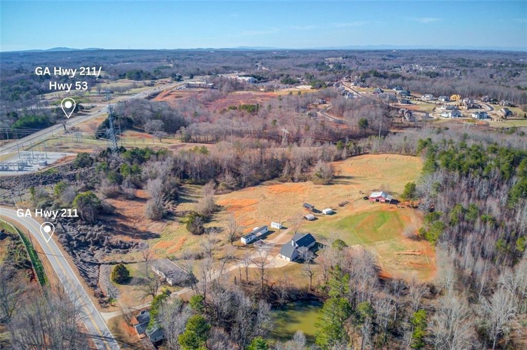 4404 Tanners Mill Road Braselton, GA 30517 - Photo 1 of 76 an aerial view of residential houses with outdoor space