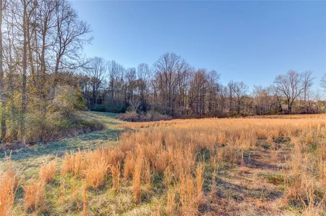a kitchen with center island dining table and chairs