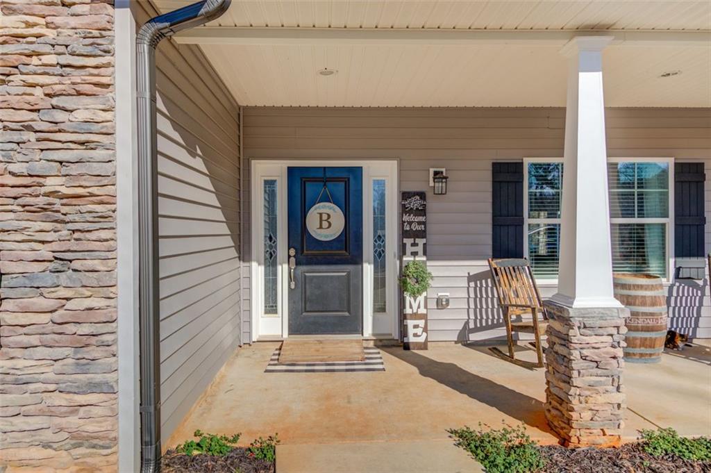 4404 Tanners Mill Road Braselton, GA 30517 - Photo 23 of 76 a front view of a house with outdoor space and seating space