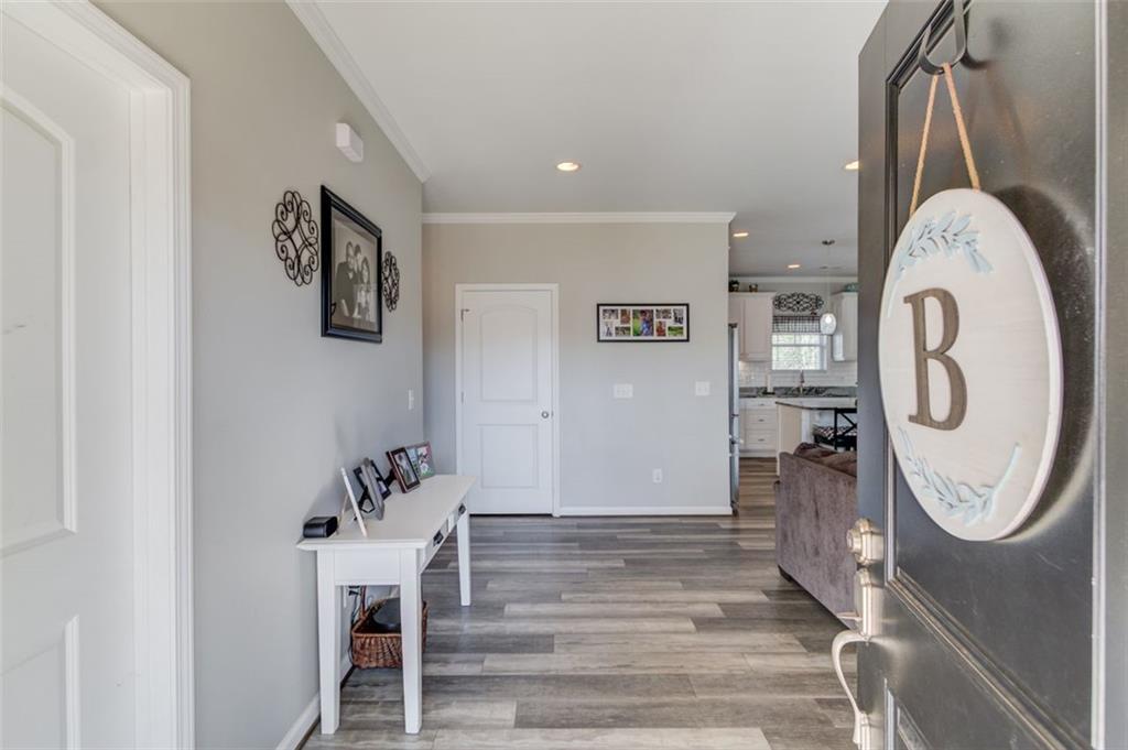 4404 Tanners Mill Road Braselton, GA 30517 - Photo 24 of 76 a view of a hallway with washer and dryer