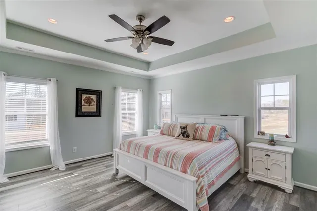 a view of road with card and trees