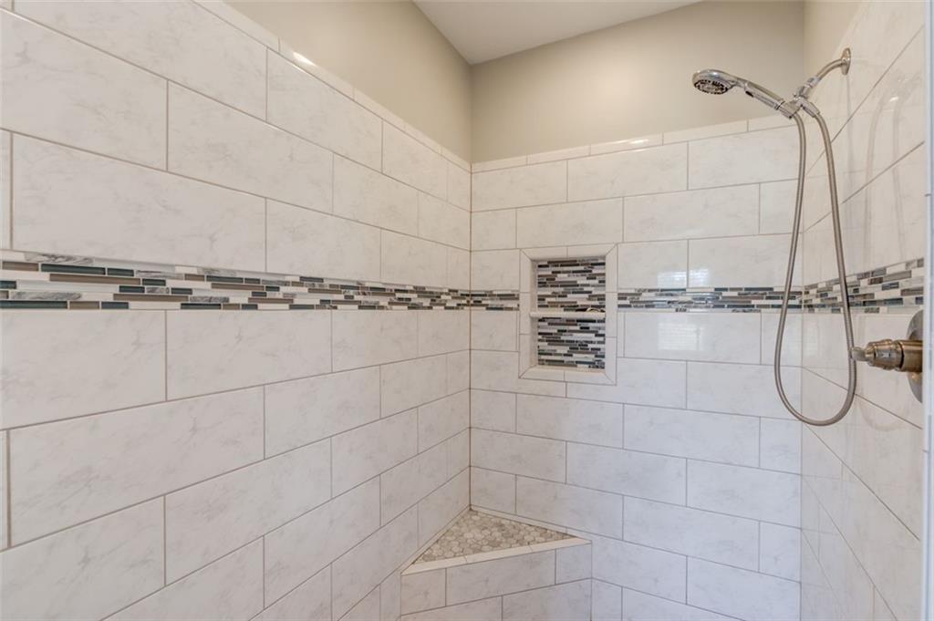 4404 Tanners Mill Road Braselton, GA 30517 - Photo 35 of 76 a bathroom with a shower