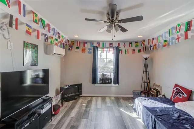 a bedroom with furniture and flat screen tv