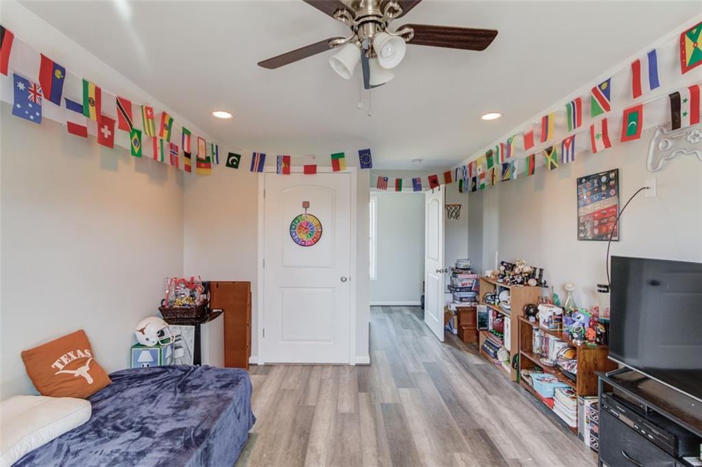 4404 Tanners Mill Road Braselton, GA 30517 - Photo 44 of 76 a room with furniture and wooden floor