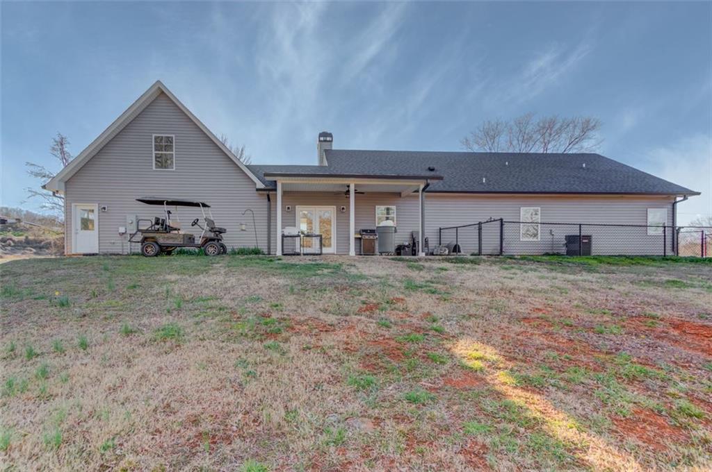 4404 Tanners Mill Road Braselton, GA 30517 - Photo 47 of 76 a front view of a house with a yard and garage