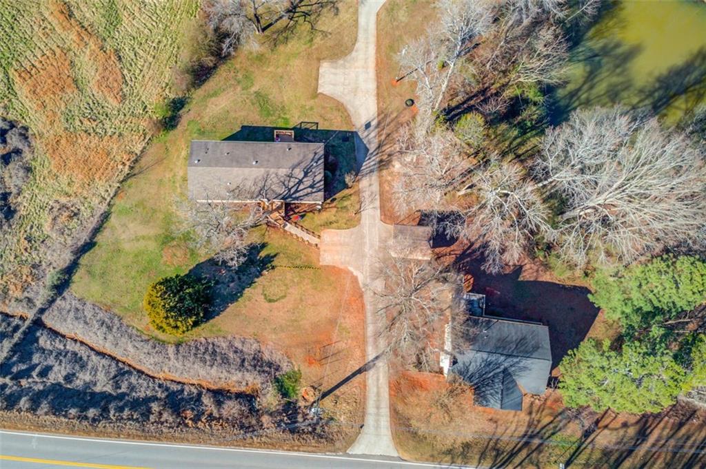 4404 Tanners Mill Road Braselton, GA 30517 - Photo 50 of 76 a view of a yard and front view of a house