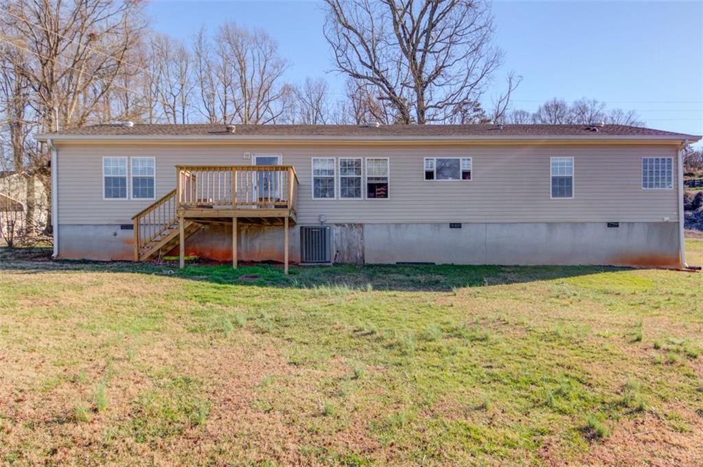 4404 Tanners Mill Road Braselton, GA 30517 - Photo 70 of 76 front view of a house with a big yard