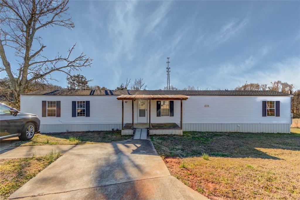 4404 Tanners Mill Road Braselton, GA 30517 - Photo 72 of 76 a front view of a house with a yard
