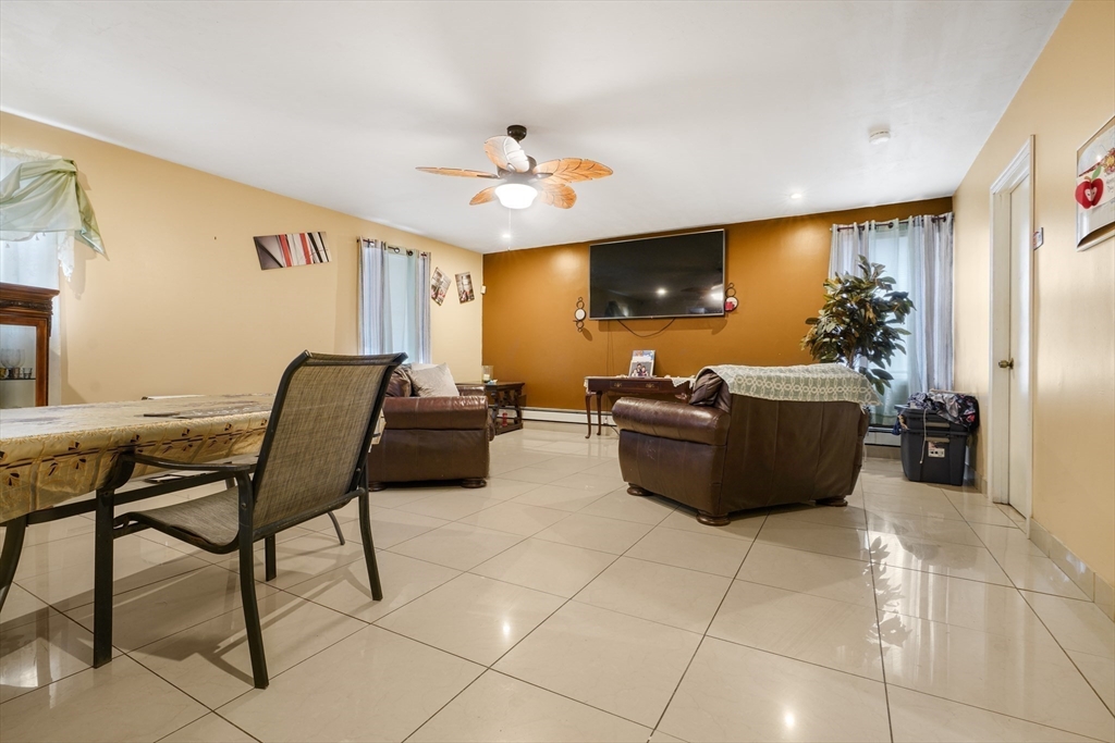 76 Price Place Fall River, MA 02724 - Photo 13 of 27 a living room with furniture and a flat screen tv