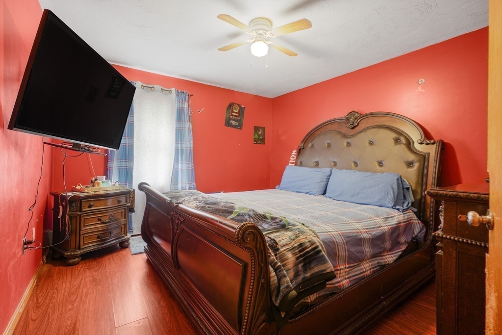 76 Price Place Fall River, MA 02724 - Photo 19 of 27 a bed room with a bed and a television