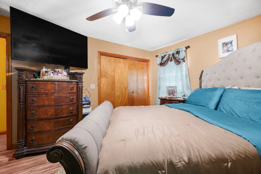 76 Price Place Fall River, MA 02724 - Photo 20 of 27 a bedroom with a bed and a flat screen tv