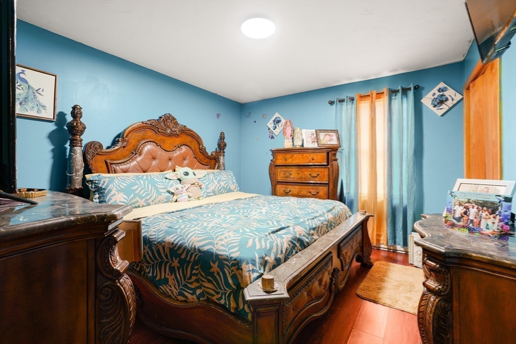 76 Price Place Fall River, MA 02724 - Photo 23 of 27 a bed sitting in a bedroom next to a window