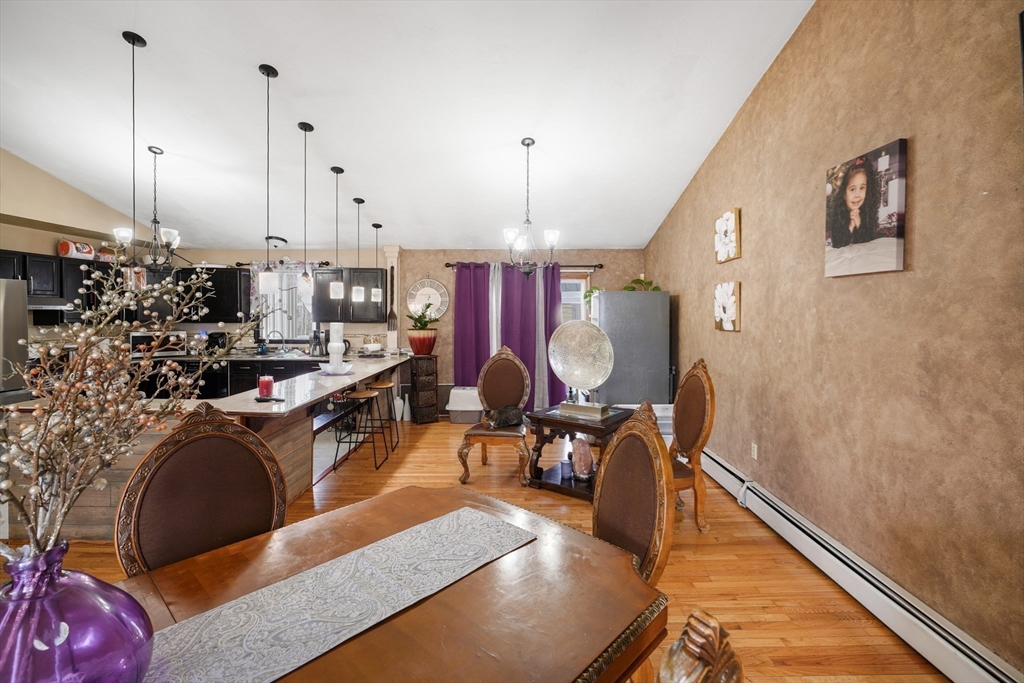 76 Price Place Fall River, MA 02724 - Photo 4 of 27 a living room with lots of furniture and a chandelier