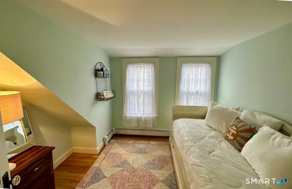 a bed room with a bed and a window
