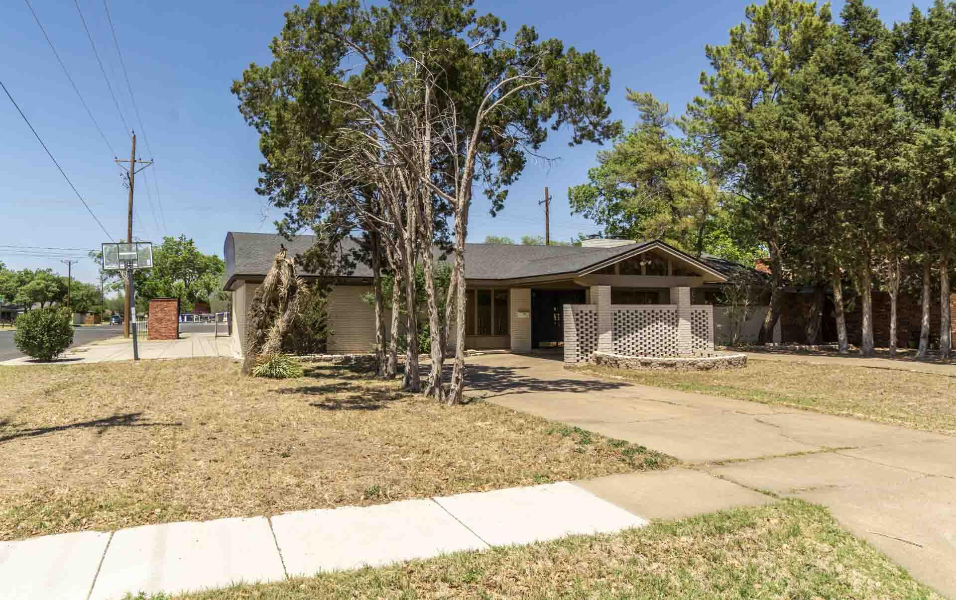 2136 57th Street Lubbock, TX 79412 - Photo 39 of 41 a front view of a house with a yard