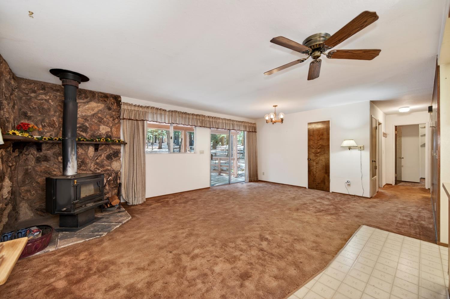 20191 Kit Court Volcano, CA 95689 - Photo 19 of 54 a view of a livingroom with hardwood floor and a ceiling fan