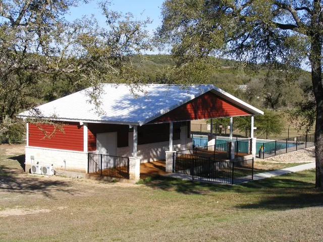 a backyard of a house with yard and outdoor seating