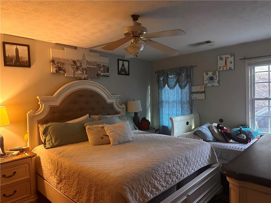 1637 Roman Point Drive Norcross, GA 30093 - Photo 11 of 21 a bedroom with a bed and window
