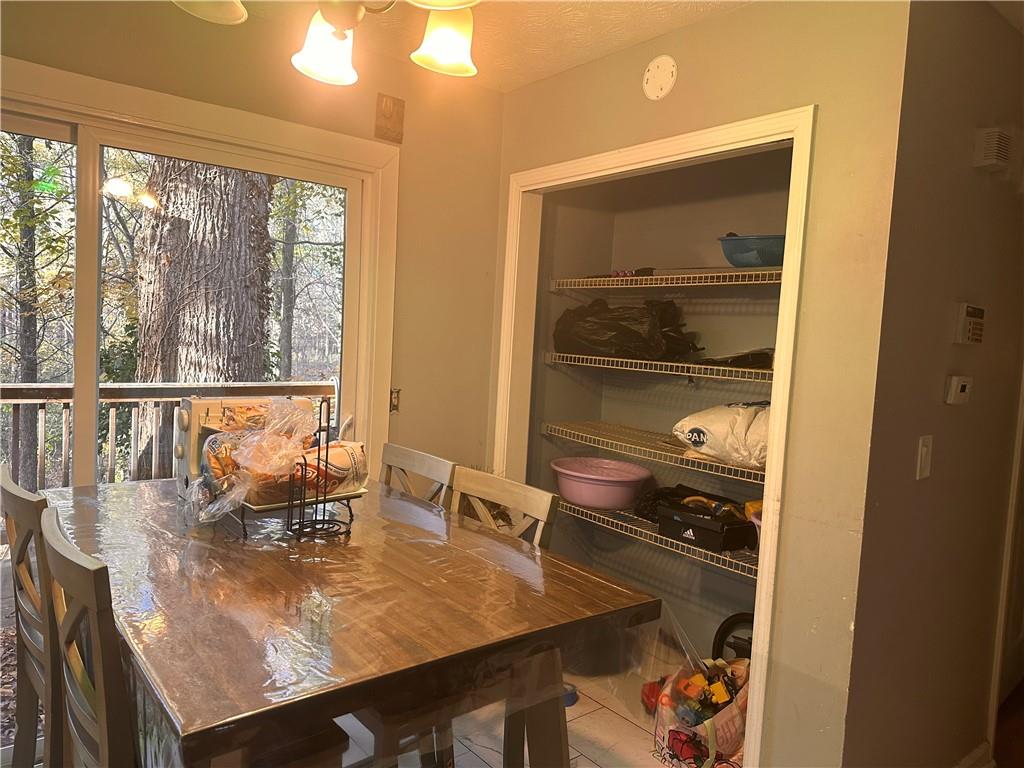 1637 Roman Point Drive Norcross, GA 30093 - Photo 13 of 21 a dining room with wooden floor